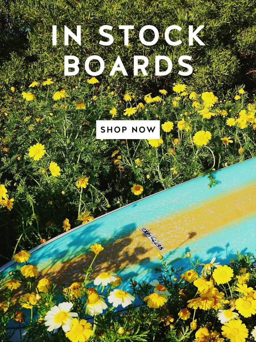 Express surfboard lying in flowers - Mobile