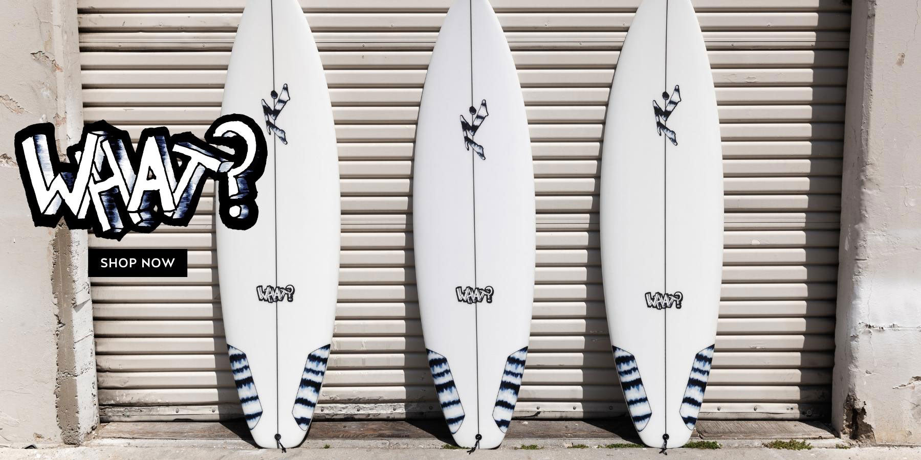 What surfboard models laid against a garage - Rusty Surfboards - Desktop