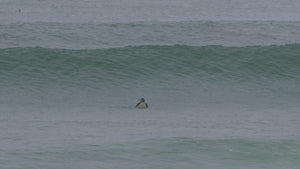 Kahana Kalama riding the Lowrider midlength surfboard by Rusty Surfboards